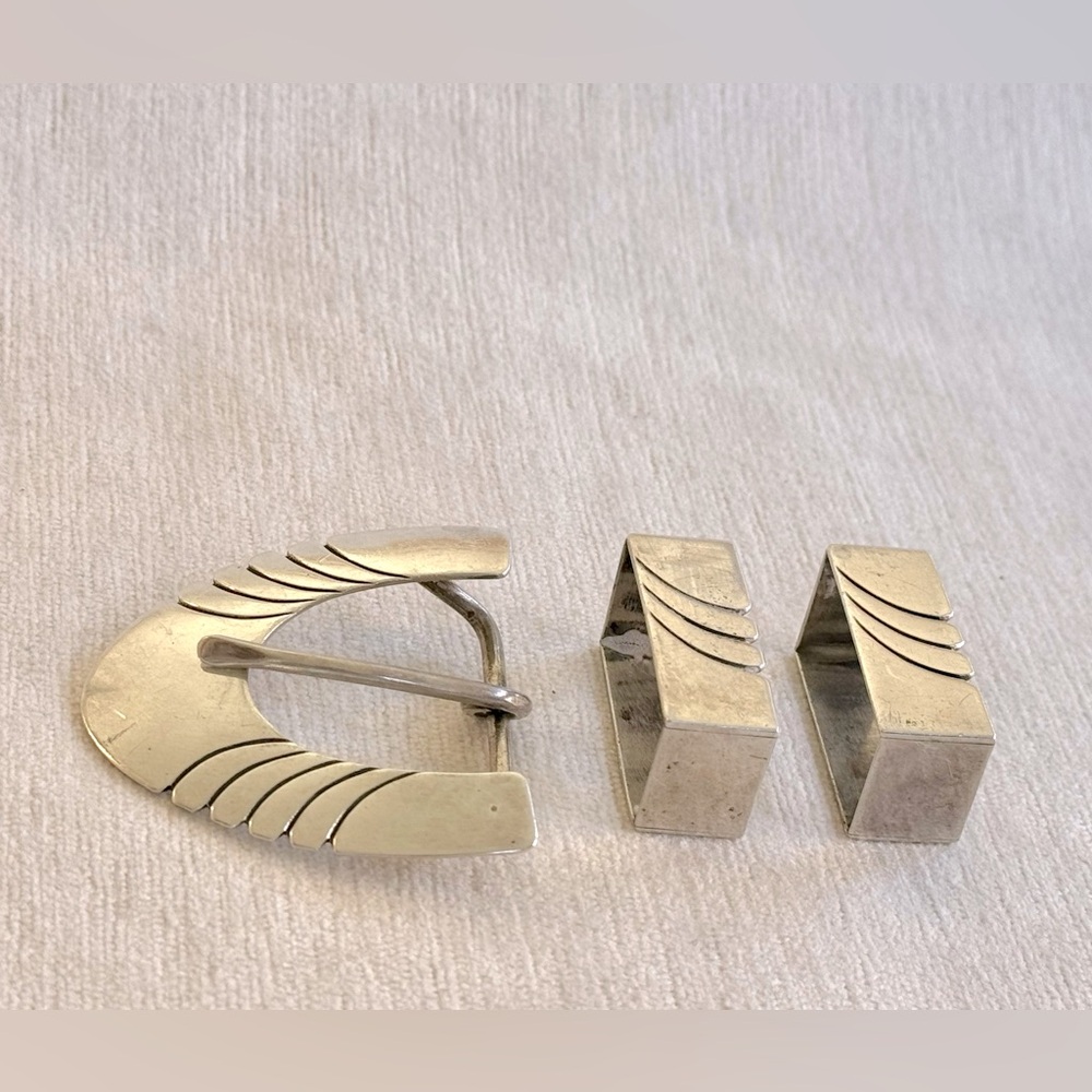 Vintage sterling silver belt buckle and two keepers. Marked “SY Sterling”